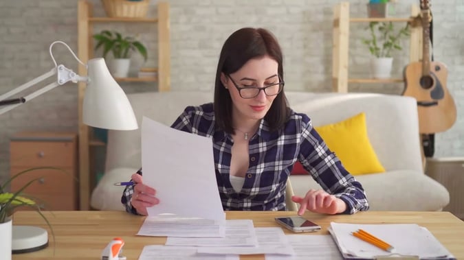 bookkeeper reviewing docs