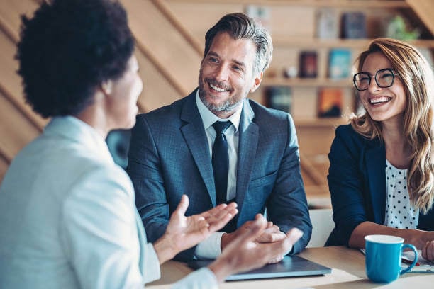 a professional with two smiling clients