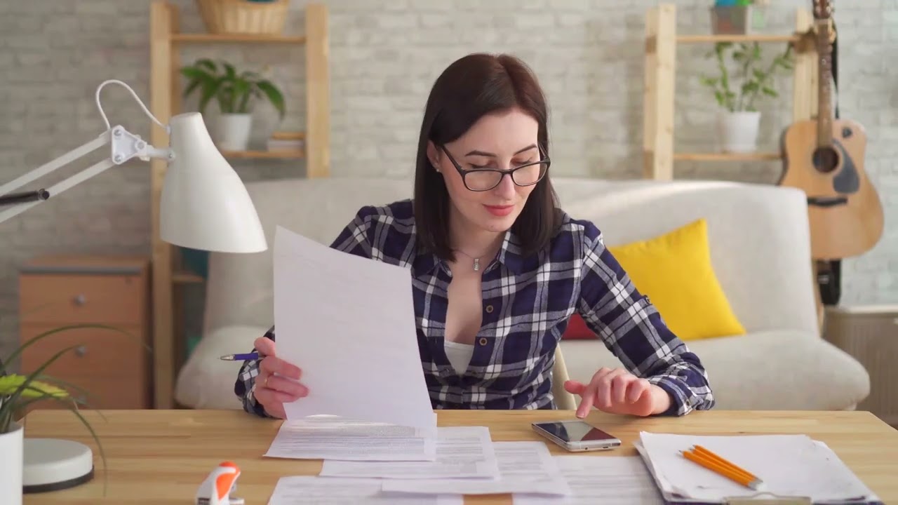 bookkeeper reviewing docs