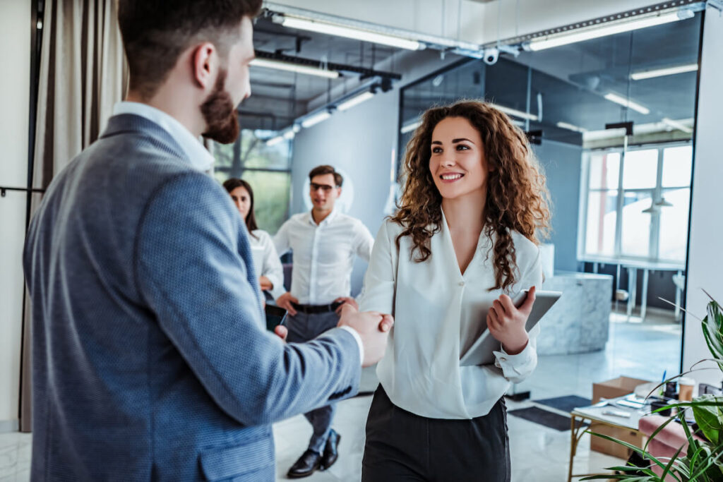 woman shaking hand of a client