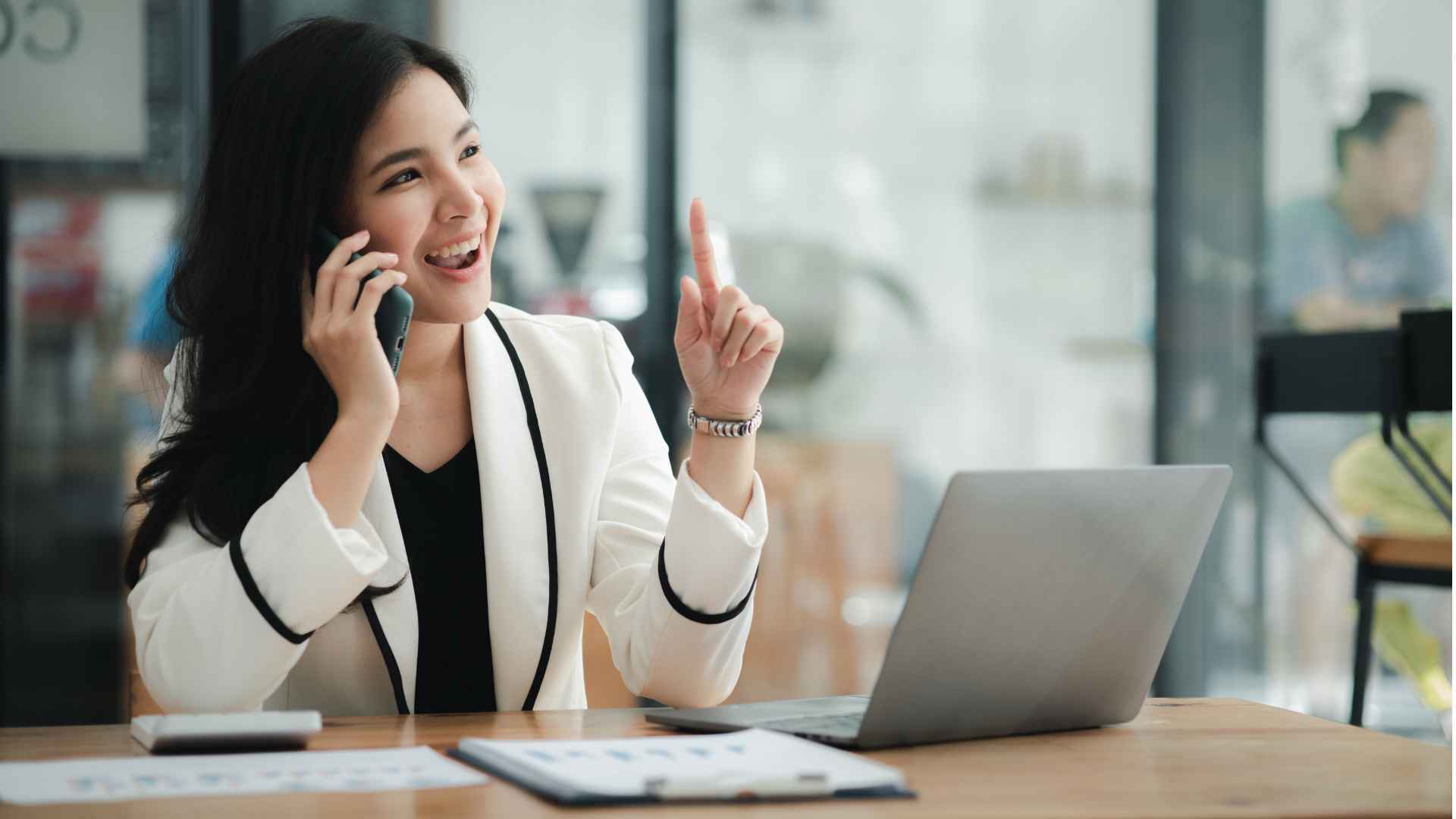 happy professional speaking on the phone